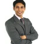 close up portrait smiling indian business man arms crossed isolated white 51833634